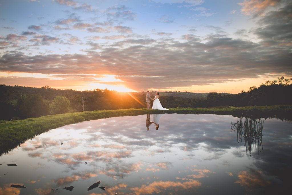 Kintara and Christian at sunset beside the lake at Carlei Estate in Beaconsfield, photographed by Pause The Moment wedding photography